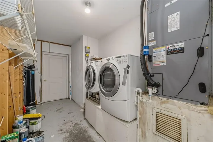 Washroom with washer and dryer and heating unit