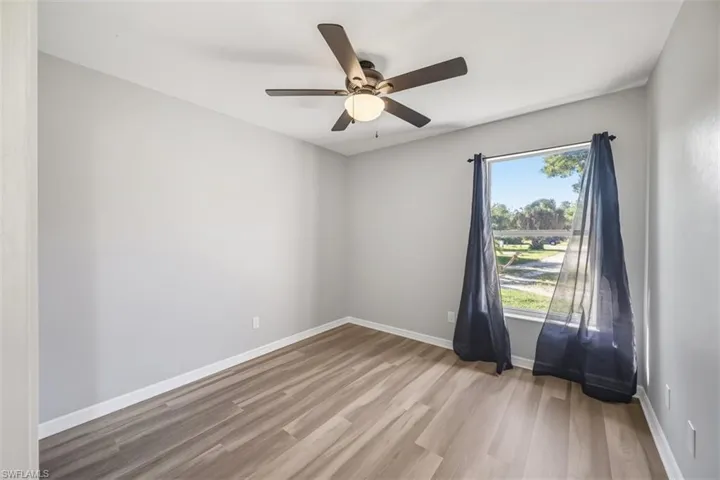 Spare room with light wood-style flooring and a ceiling fan