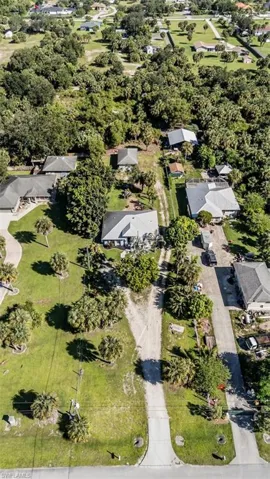 Aerial overview of property's location with nearby suburban area