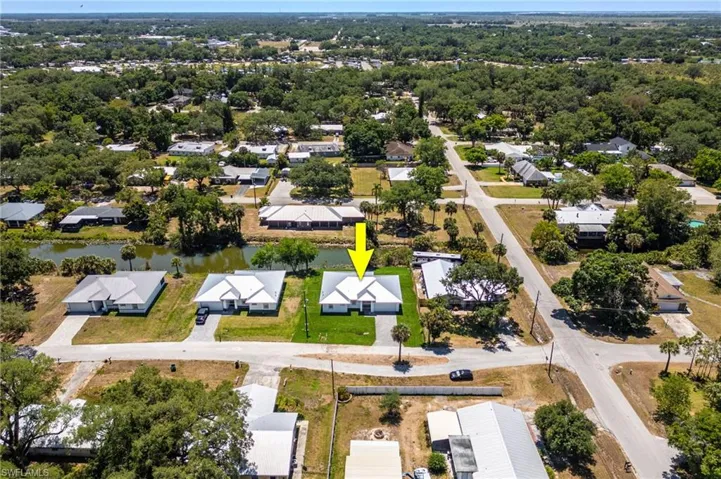 Birds eye view of property featuring a residential view and a water view