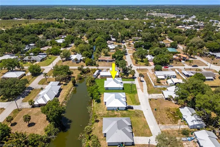Aerial view featuring a water view and a residential view
