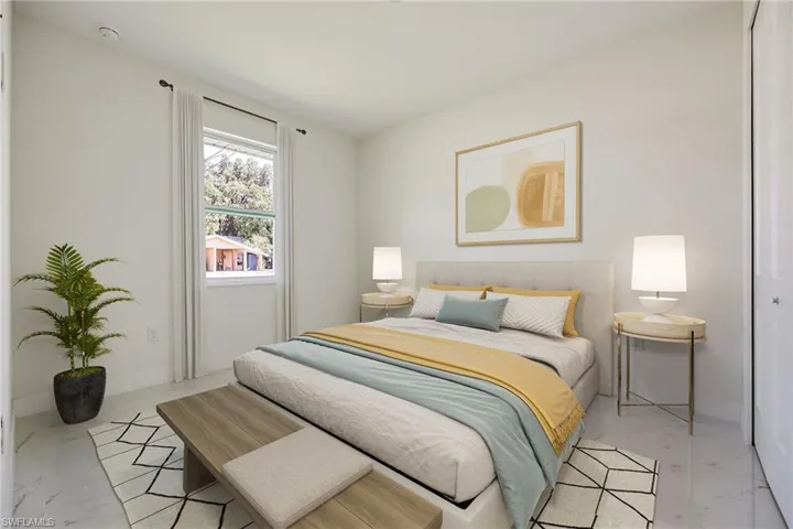 Bedroom featuring marble finish floor