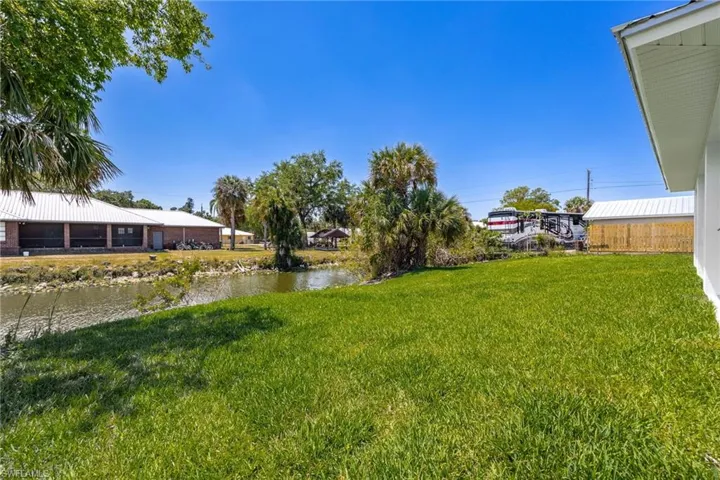View of yard with a water view