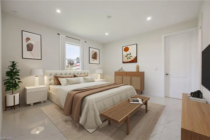 Bedroom featuring recessed lighting and marble finish floor