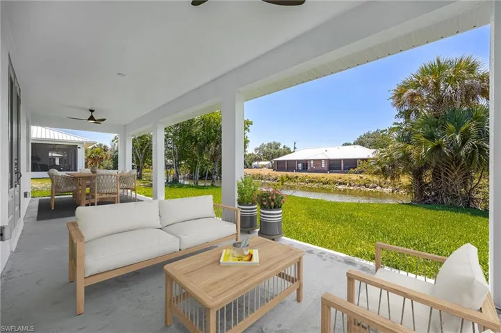 View of patio / terrace featuring a ceiling fan, an outdoor living space, and outdoor dining area