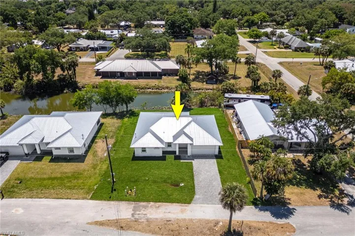 Aerial view with a residential view and a water view