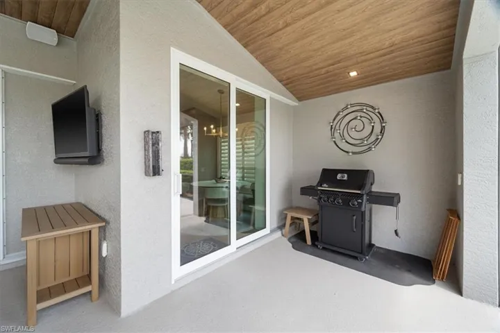 View of patio featuring a grill