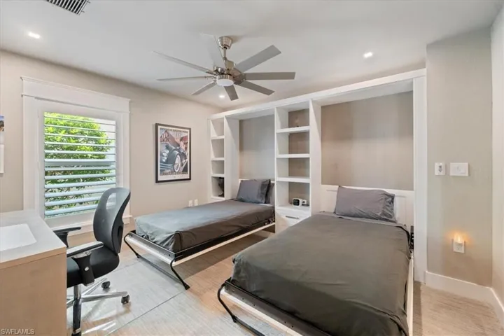 Bedroom with recessed lighting, ceiling fan, and a desk