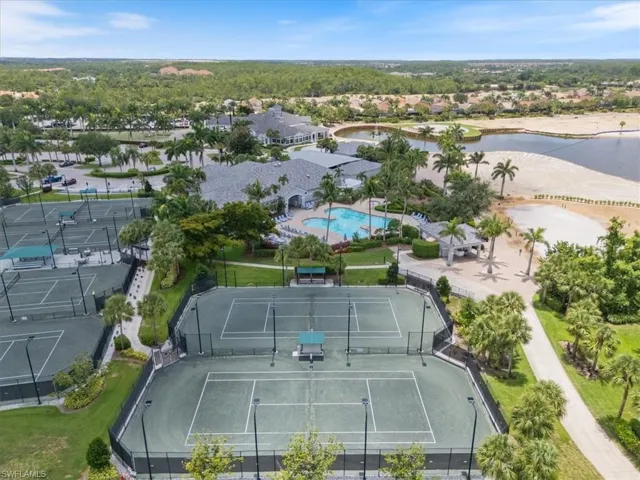 Aerial view of residential area featuring a pool