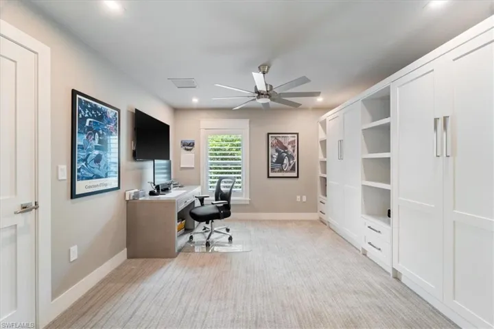 Office space featuring ceiling fan, light carpet, and recessed lighting