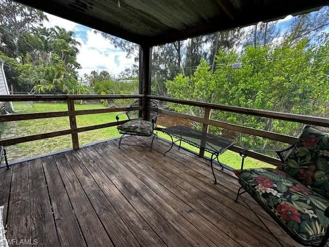 Deck featuring a lawn