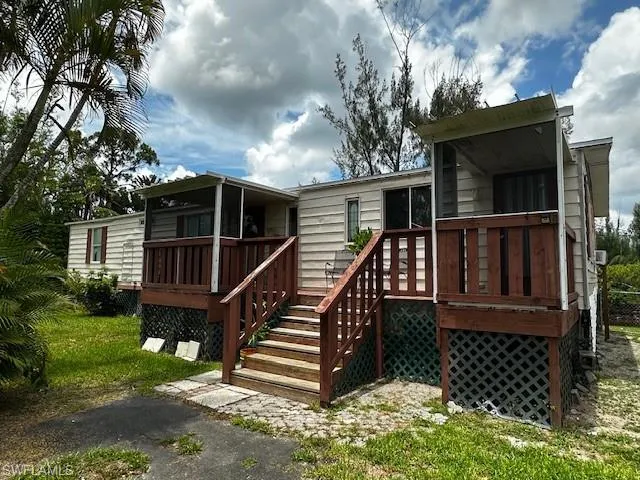 Back of property featuring a deck