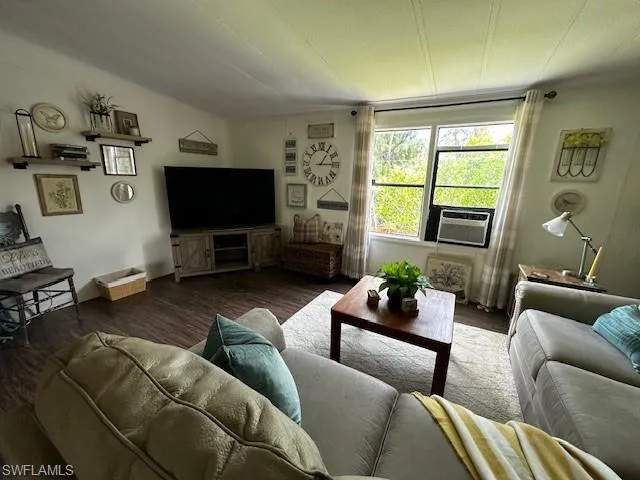 Living room with wood-type flooring