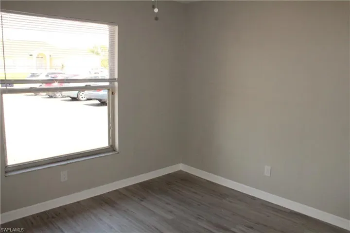 Spare room featuring hardwood / wood-style flooring