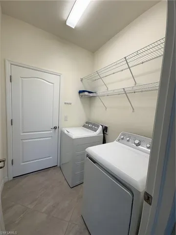 Laundry room featuring independent washer and dryer