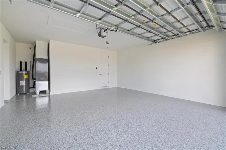 Garage with electric water heater and heating unit