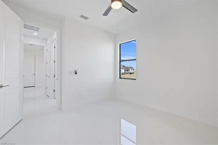 Unfurnished bedroom featuring a ceiling fan and recessed lighting
