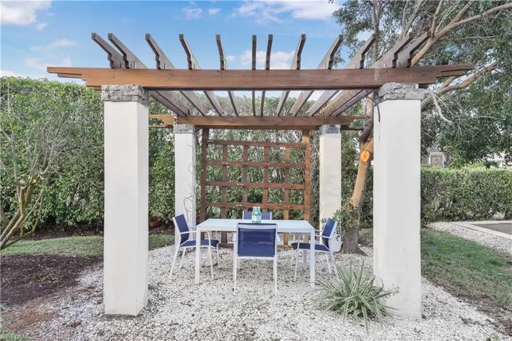 View of patio featuring outdoor dining space and a pergola