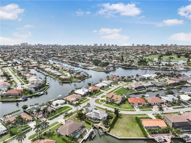 Aerial overview of property's location featuring a skyline view and nearby suburban area