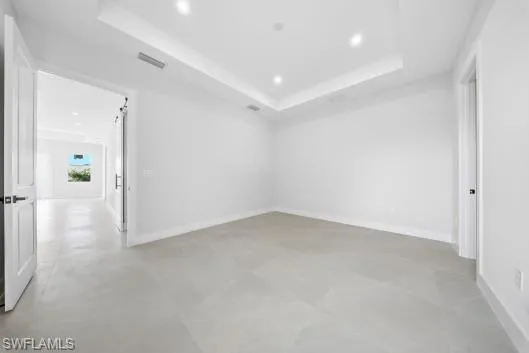 Unfurnished room with baseboards and recessed lighting