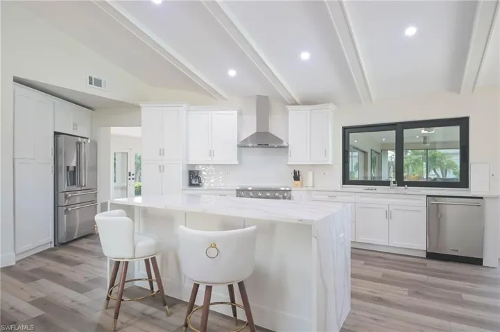 Island with seating!  Quartz counter tops!  LED lighting!