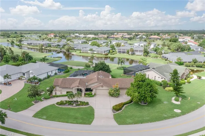 Circular drive with (4.5) car garages!  Tile Roof replaced in 2019!