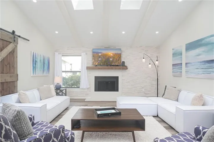 Family Room accented with Fireplace!  Stone accented wall!