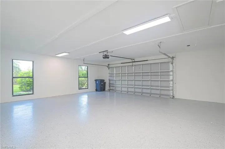 Air Conditioned!  Epoxy Flooring!  New Garage, Hurricane-Rated Doors!