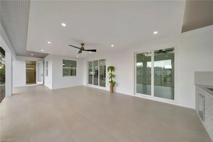 View of patio featuring ceiling fan
