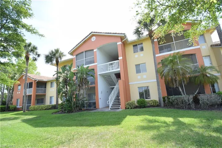 View of property with stairs