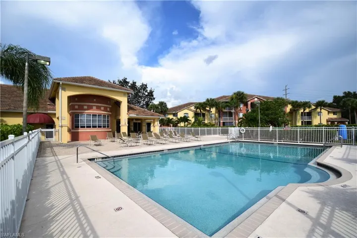 Community pool featuring a patio