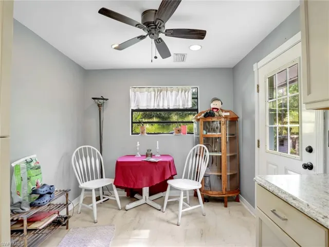 Dining room with healthy amount of natural light, a ceiling fan, and recessed lighting