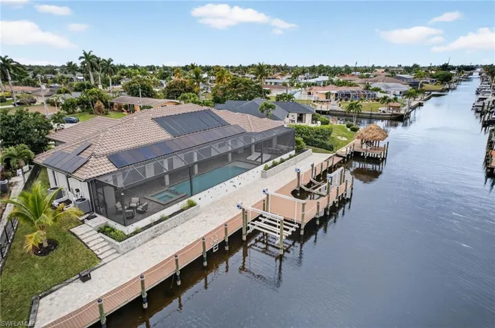 Aerial perspective of suburban area with a nearby body of water