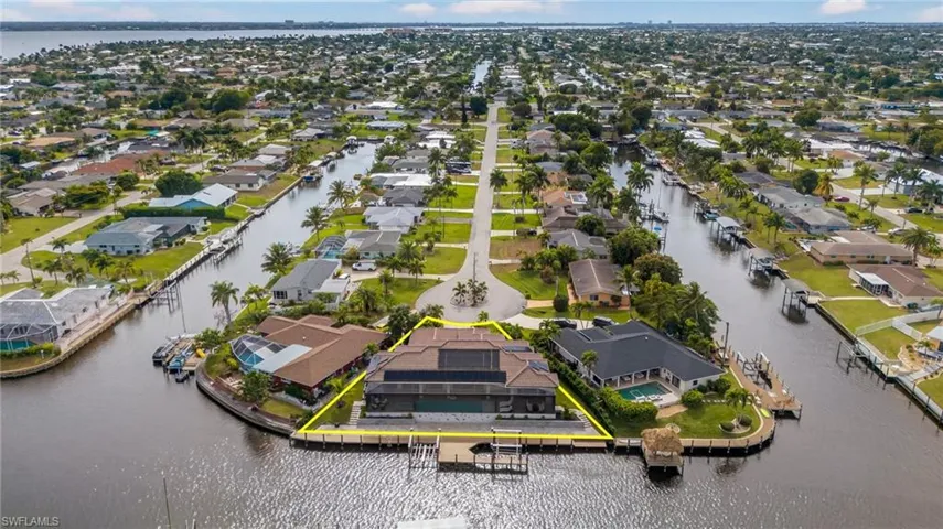Aerial perspective of suburban area with a large body of water