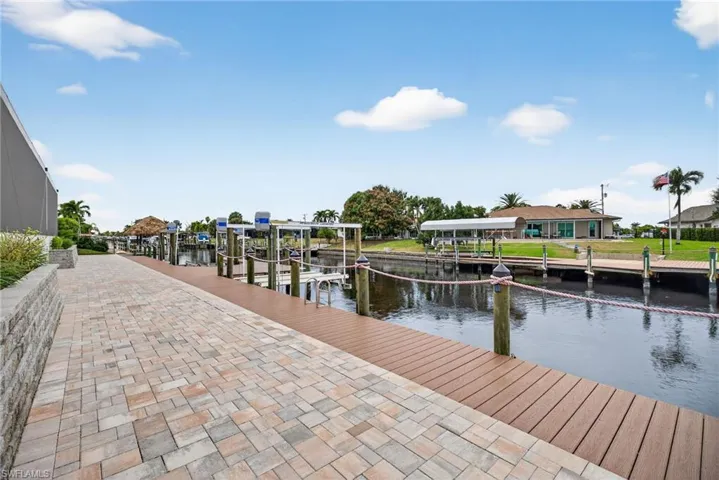 Dock with boat lift and a water view