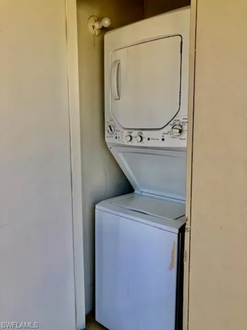 Laundry area featuring stacked washer and dryer