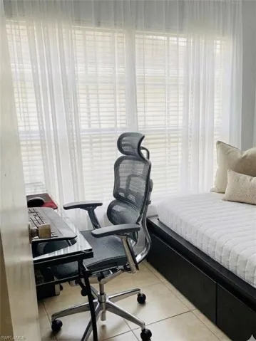 DEN .Bedroom featuring light tile patterned floors