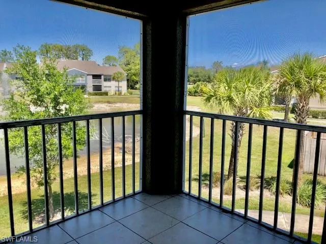 Balcony featuring a sunroom