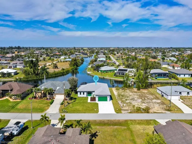 Aerial view featuring a residential view and a water view
