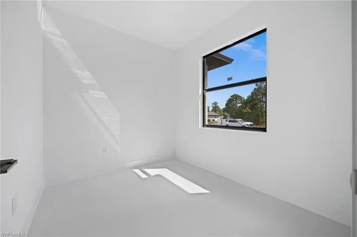 Unfurnished room featuring baseboards