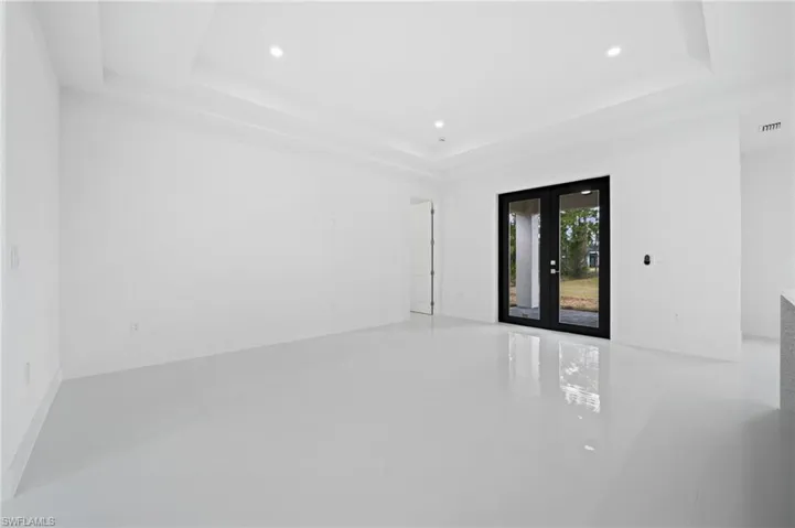 Spare room featuring french doors and recessed lighting