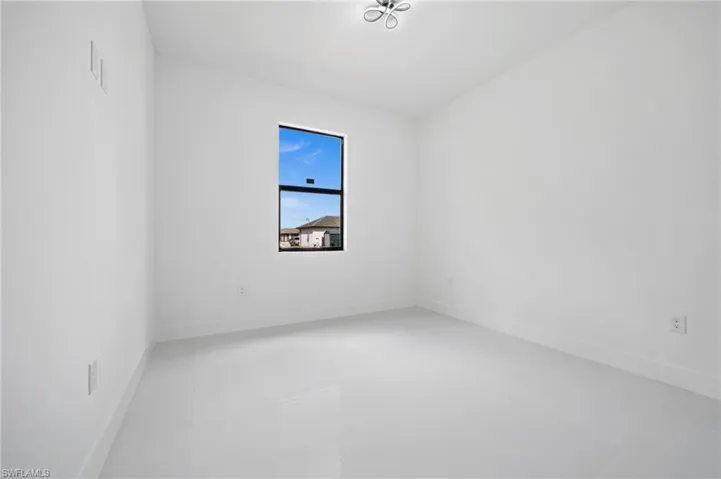 Spare room featuring baseboards