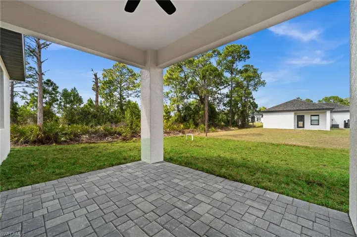 View of patio featuring ceiling fan