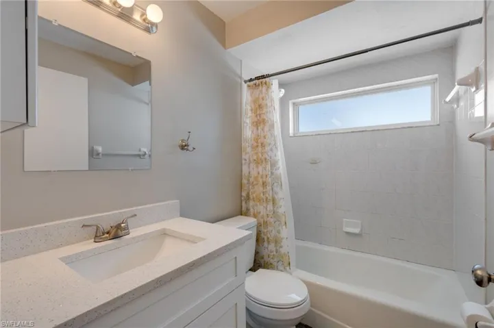 Full bath with vanity and shower / bathtub combination with curtain