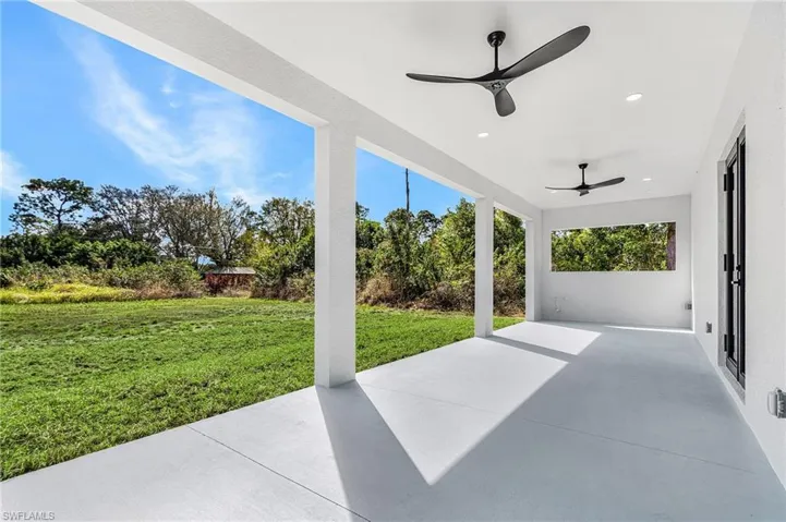 View of patio featuring ceiling fan