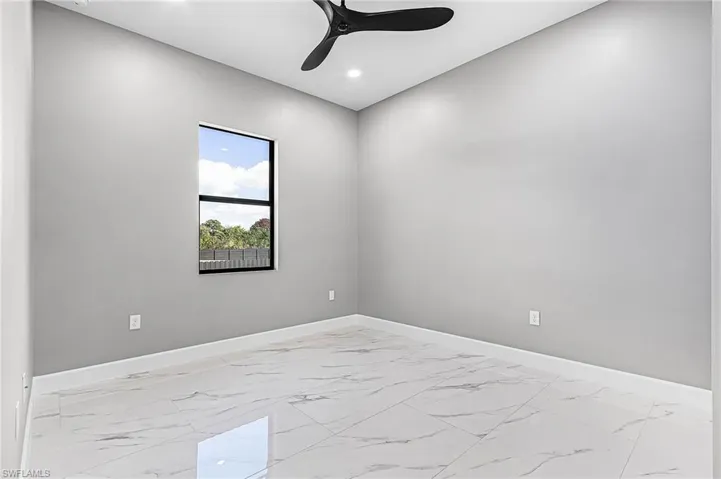 Unfurnished room featuring light porcelain finish floors, recessed lighting, and a ceiling fan