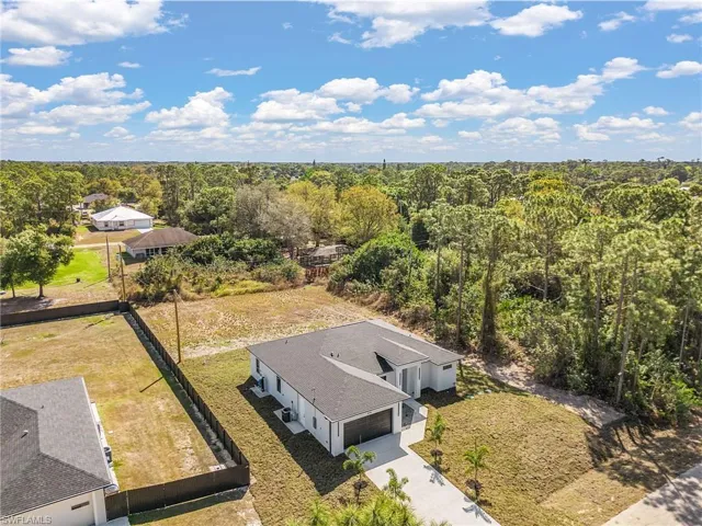 View from above of property with a heavily wooded area