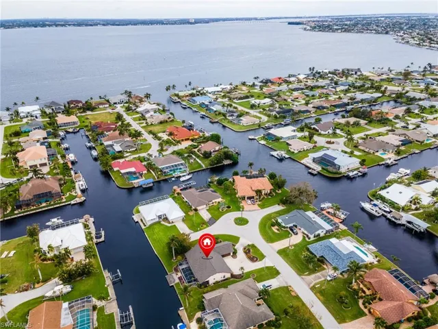 Aerial perspective of suburban area with a nearby body of water