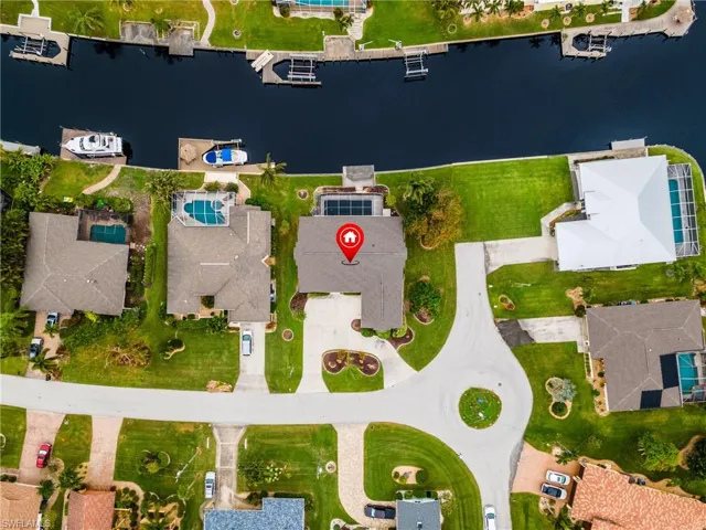 Aerial perspective of suburban area with a nearby body of water