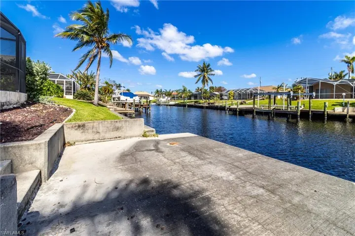 Dock featuring a water view and a residential view